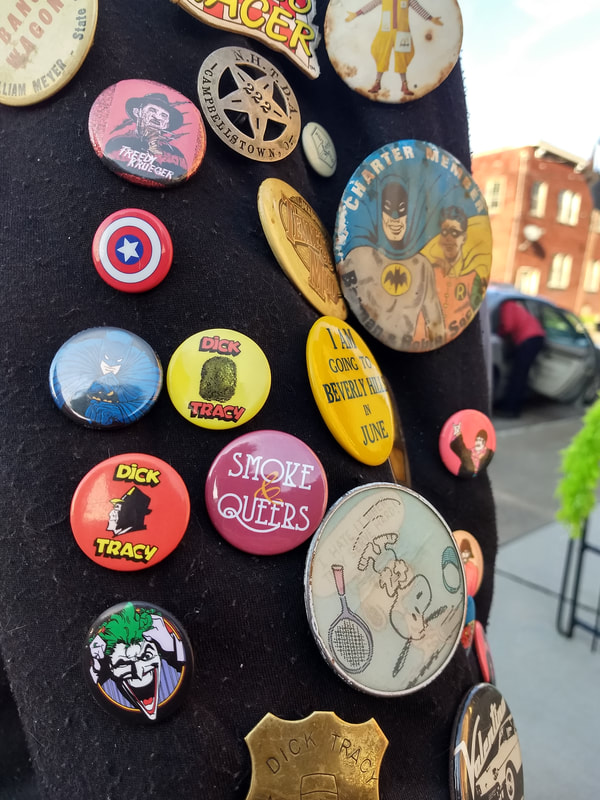 Smoke & Queers Button on a jacket. Cincinnati, Ohio. 2019.